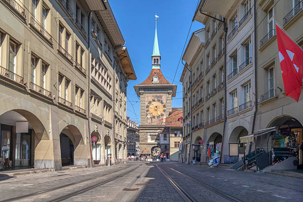 Bern, Switzerland. View of historic Zytglogge clock tower (Zytgloggeturm) and Marktgasse street