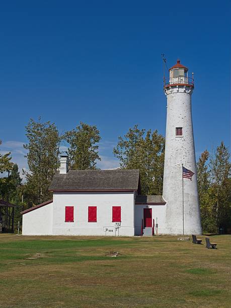 A tall tower with a weather vane on top