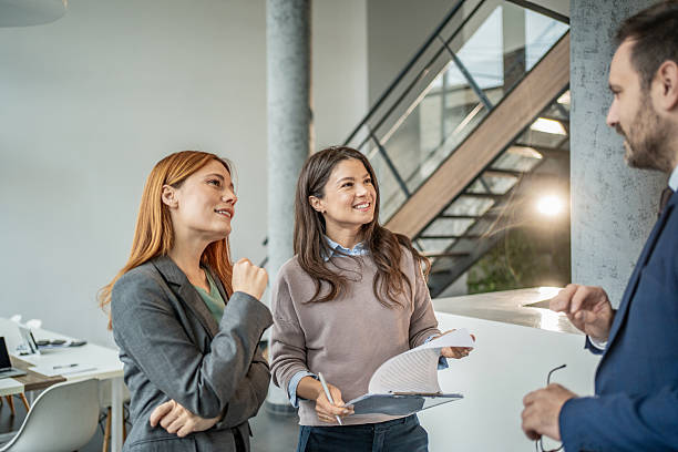 istock Business colleagues discussing project ideas in modern office 2251415099