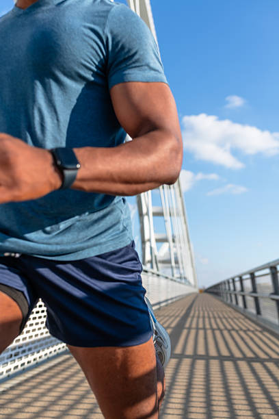 istock Fit athlete running outdoors close-up 2251415117