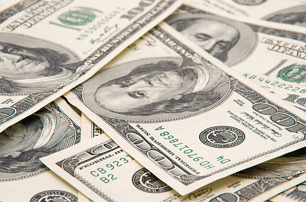 istock heap of dollars, money background 2251416384