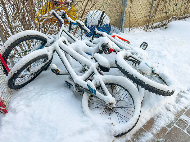 istock Snow covered bicycles in winter yard 2251416980