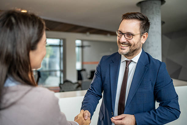 istock Successful business people shaking hands in office 2251418024