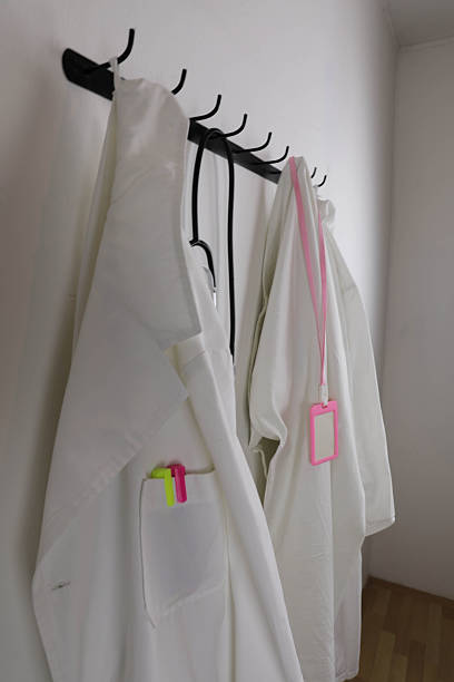 istock Clinical Workwear Hanging In Medical Office 2251421124