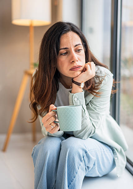 istock Sad woman thinking and feeling depressed at home 2251421571