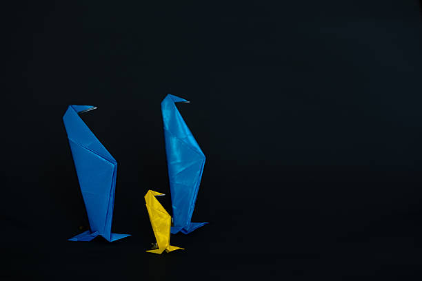 Two Male Penguins and Child Origami Figures