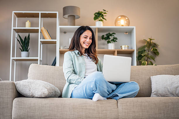 istock Woman working remotely at home using laptop 2251422268