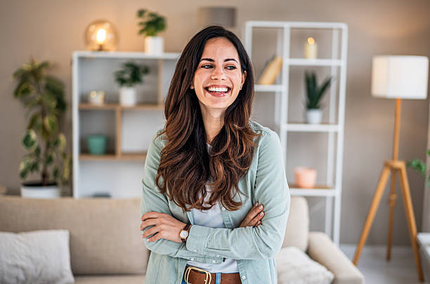 istock Young woman smiling at home feeling happy and confident 2251422843