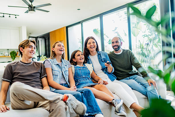 istock Family watching tv at home 2251422990