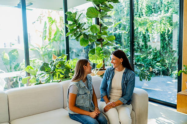 istock Mother and daughter talking at home 2251423056