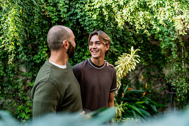 istock Father and son talking on house yards garden 2251423294