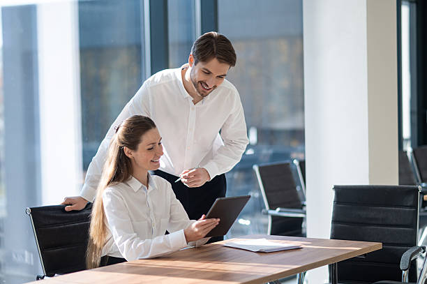 istock Colleagues working together in the office and looking focused 2251423419