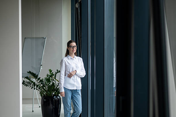 istock Young female manager working in the office and looking busy 2251423596