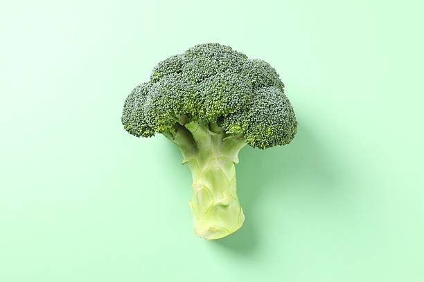 istock Fresh green broccoli on color table 2251425618