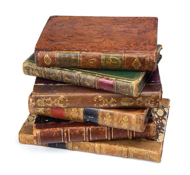 istock Stack of old books with leather covers placed on a white background. A stack of antique old books 2251429148