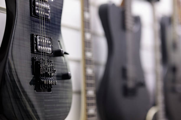 istock electric guitars hanging on a wall in music store 2251429704