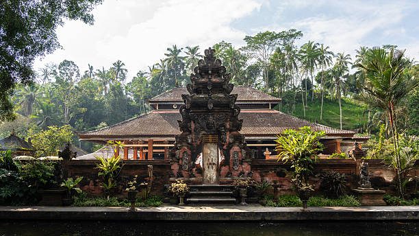 istock Typical Balinese gate in a temple surrounded by nature at dawn 2251432148