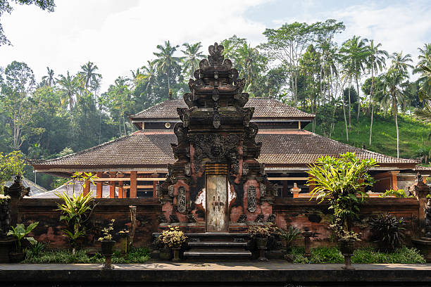 istock Typical Balinese gate in a temple surrounded by nature at dawn 2251432152