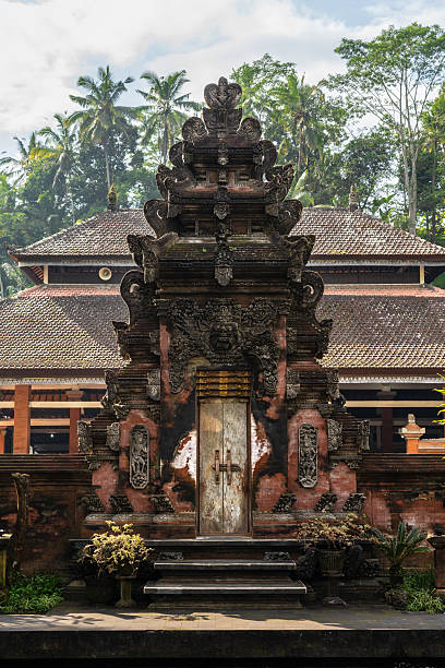 istock Typical Balinese gate in a temple surrounded by nature at dawn 2251432153