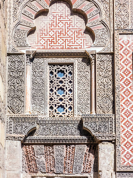 Courtyard of the beautifully Ben Youssef Medersa, a historic Islamic college in Marrakech, Morocco.