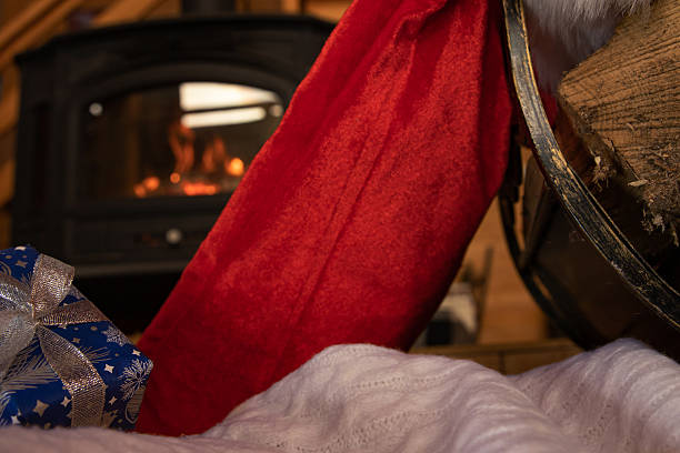 istock Firewood basket with Santa hat creating festive rustic holiday mood 2251432460