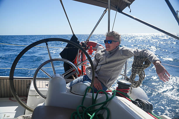 istock Relaxed man steering sailing yacht on open sea 2251435199