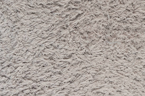 istock Soft gray rug texture with thick fibers in indoor setting 2251436801