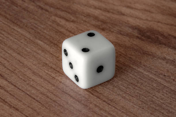 istock Close-up view of a standard white dice showing the numbers two, three, and five. 2251440876