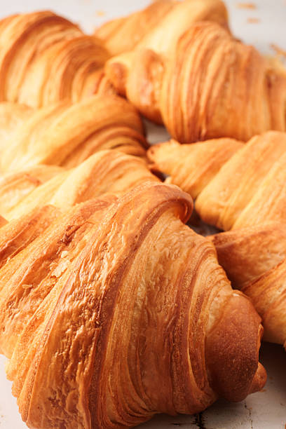 istock Fresh Golden Croissants with Flaky Layers in Close-Up View 2251445518