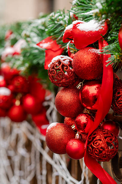 istock Red Christmas ornaments on festive decorated tree 2251448589