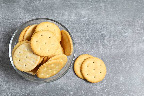 istock Delicious crispy crackers cookies on grey background 2251448662
