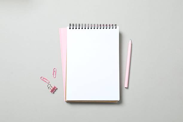 istock Open notebook, pen and stationery on grey background 2251449401