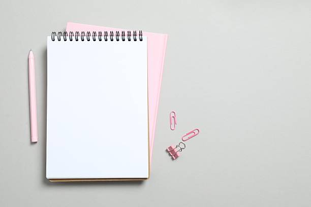 istock Open notebook, pen and stationery on grey background 2251449411