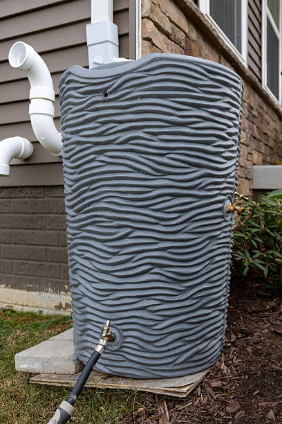 istock Rain Barrel in Front of Home 2251451328