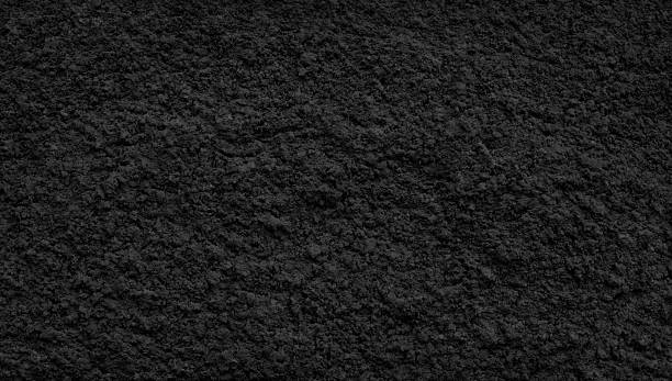 istock Black dark rough pimpled textured abstract background for wallpaper banner template page design, black plaster concrete wall 2251451578