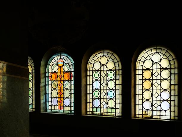 istock featuringarched geometric stained-glass windows. Natural light streams through thewindows, 2251452096