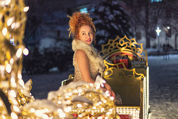 Christmas fantasy portrait of young beautiful woman