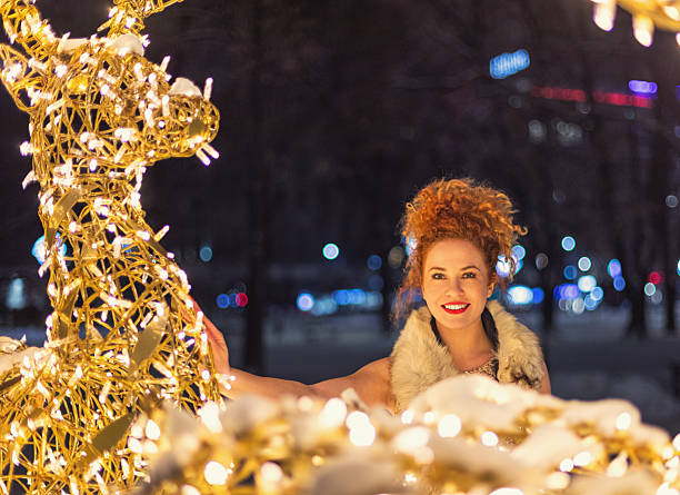 Christmas fantasy portrait of young beautiful woman