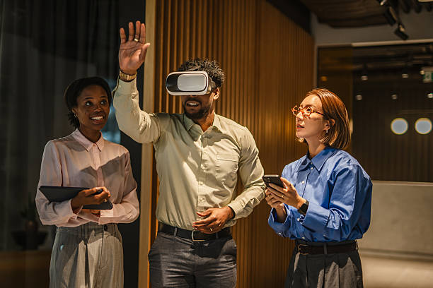 istock Diverse business team exploring virtual reality v r glasses technology 2251454379