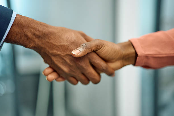 istock Business partners shaking hands making an agreement 2251455447