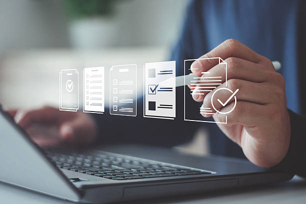 istock Businessman using laptop for digital document management paperless approval, technology workflow automation business process efficiency project authorization and corporate management approval concept. 2251457923
