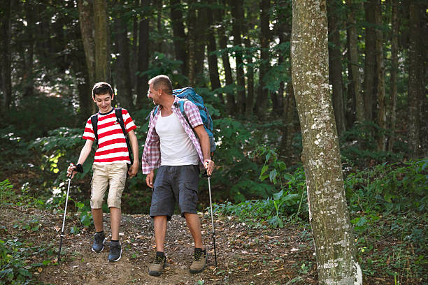 istock Forest hike with trekking poles 2251462813