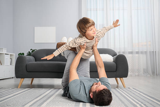 istock Father and son having fun at home 2251463653