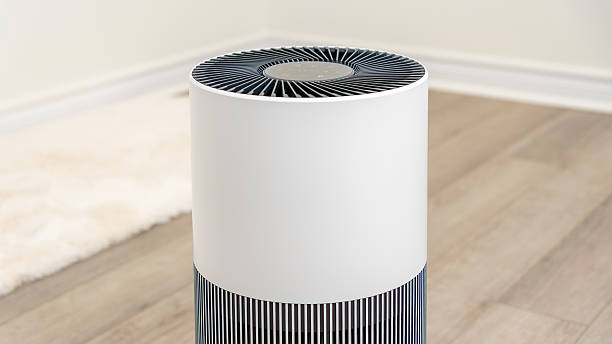 istock Modern air filter device in a bright room, showcasing sleek design and efficient air purification concept for healthier indoor environments 2251467674