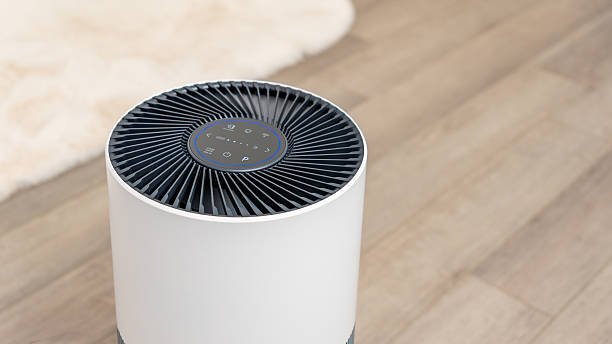 istock Modern air purifier with sleek design and control panel, placed on wooden floor, enhancing indoor air quality and promoting fresh air concept 2251467777
