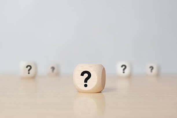 istock wooden blocks with question marks on wooden table, close up. space for text 2251471428