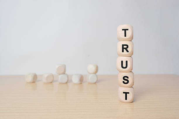 istock trust concept. wooden blocks with text on grey table. copy space 2251471537