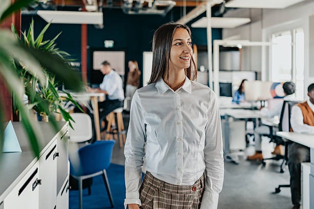 istock Workers engage in collaboration at a modern coworking space in Berlin during a busy day of productivity and teamwork 2251471720
