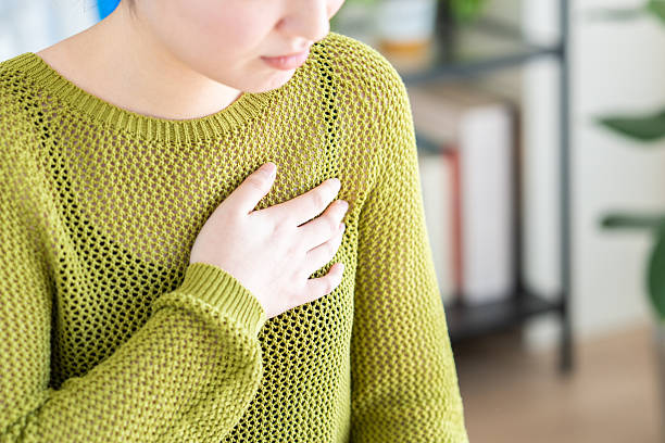 istock Young woman with chest pain 2251472686