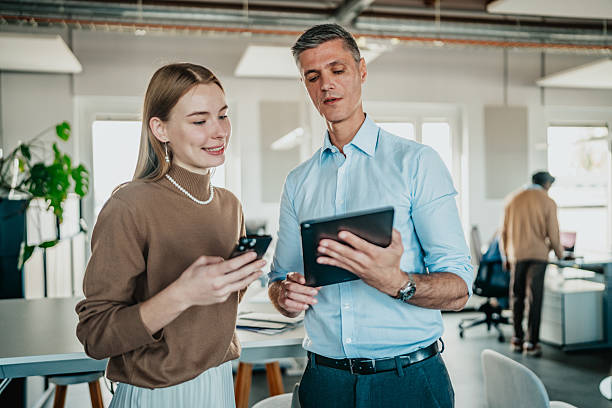 istock Colleagues communicate and share ideas in a coworking space in Berlin, Germany during work hours 2251475513